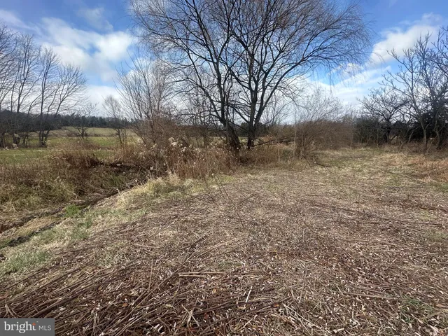 a view of a large body of water with a building in the background