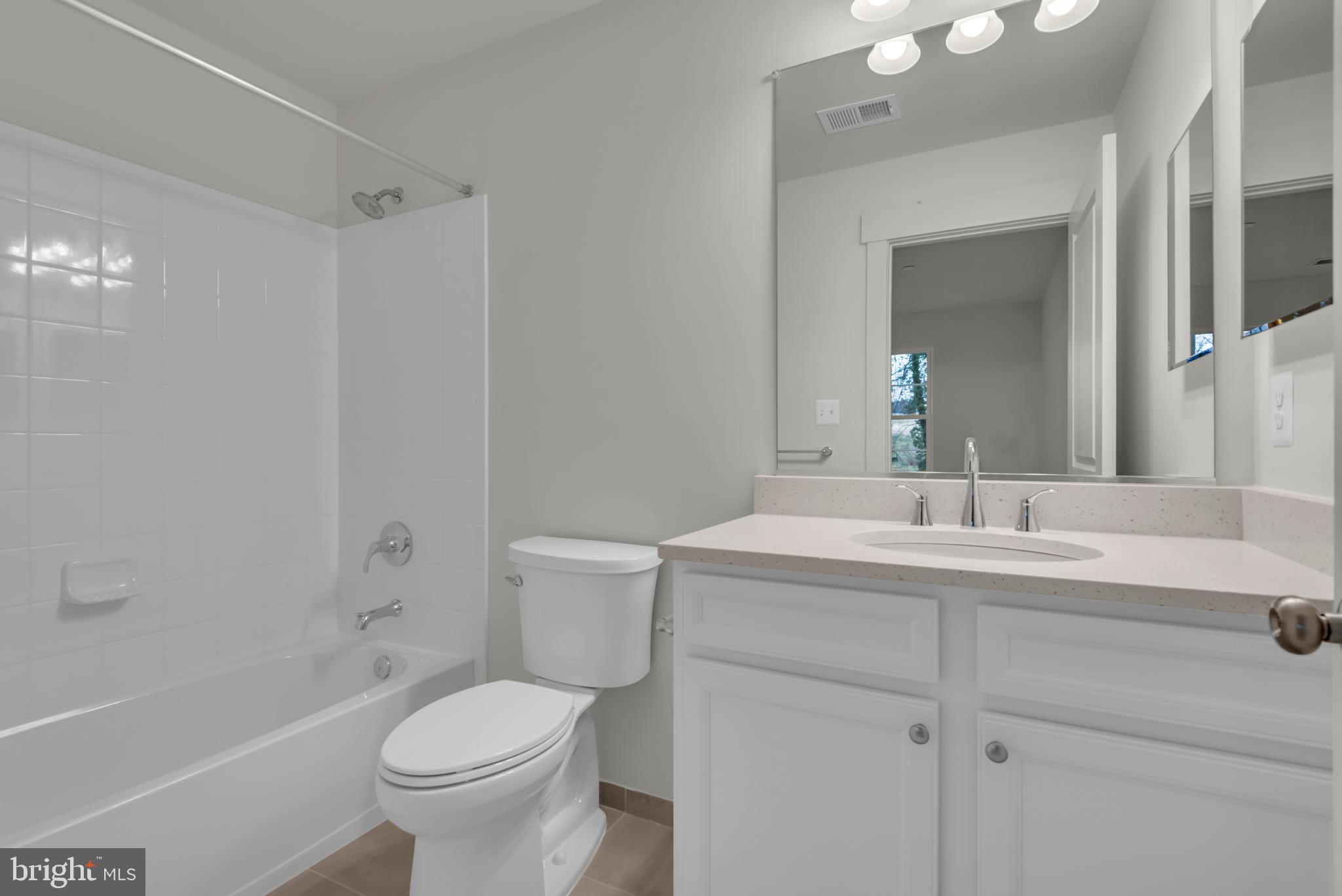 6502 Whitetail Xing Way Hanover, MD 21076 - Photo 21 of 58 a bathroom with a sink toilet vanity and shower