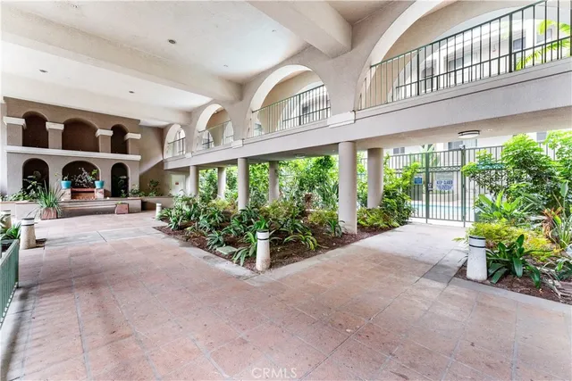 a view of parking garage with cars