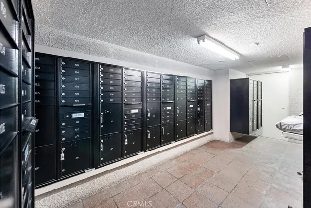 a living room with furniture a lamp and a table