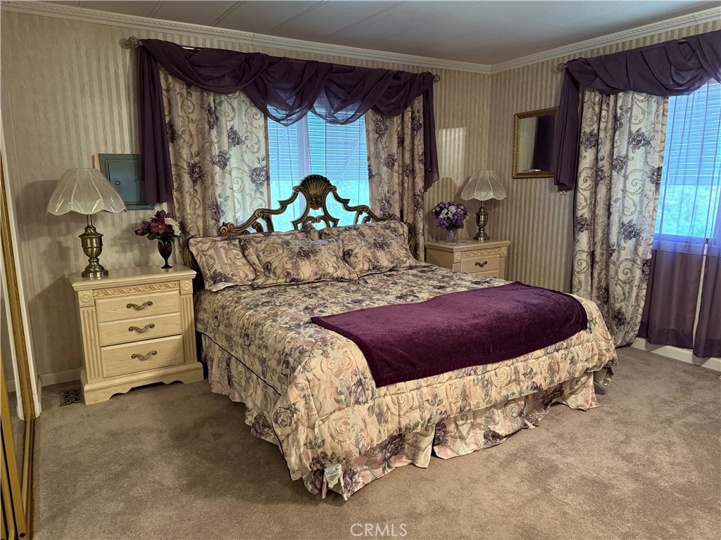 7452-7452 Live Oak Road Corning, CA 96021 - Photo 14 of 19 a bedroom with a bed and a dresser