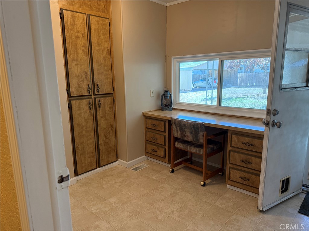 7452-7452 Live Oak Road Corning, CA 96021 - Photo 16 of 19 a room that has a bed and a window