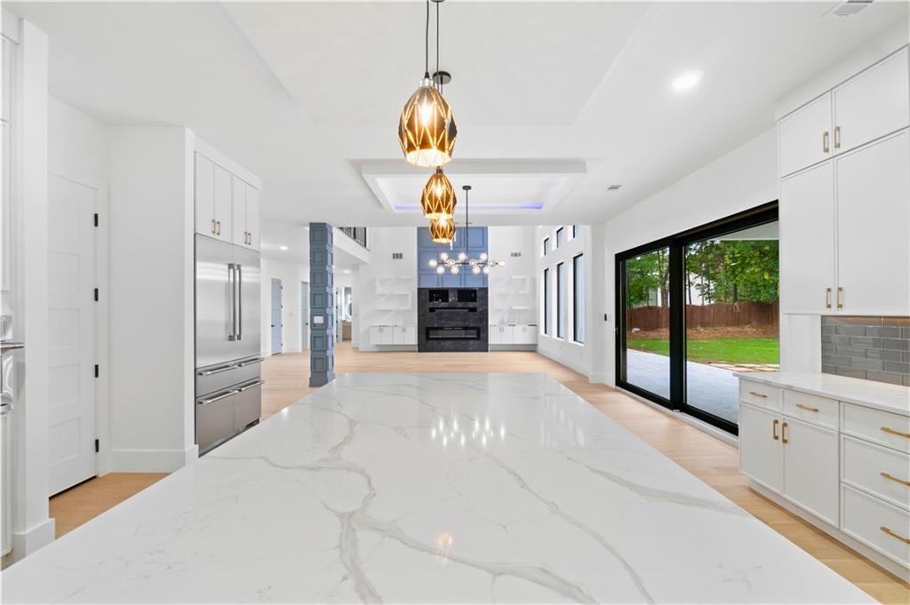 2709 Collins Hill Road Lawrenceville, GA 30043 - Photo 20 of 67 a large white kitchen with a large window