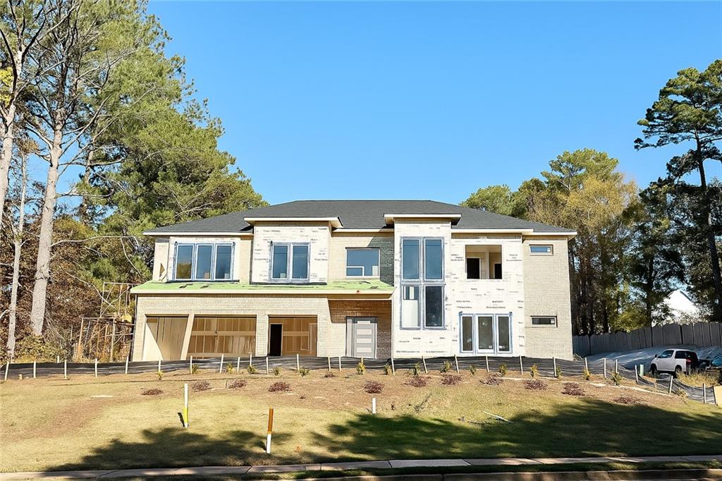 2709 Collins Hill Road Lawrenceville, GA 30043 - Photo 2 of 67 a front view of a house with windows