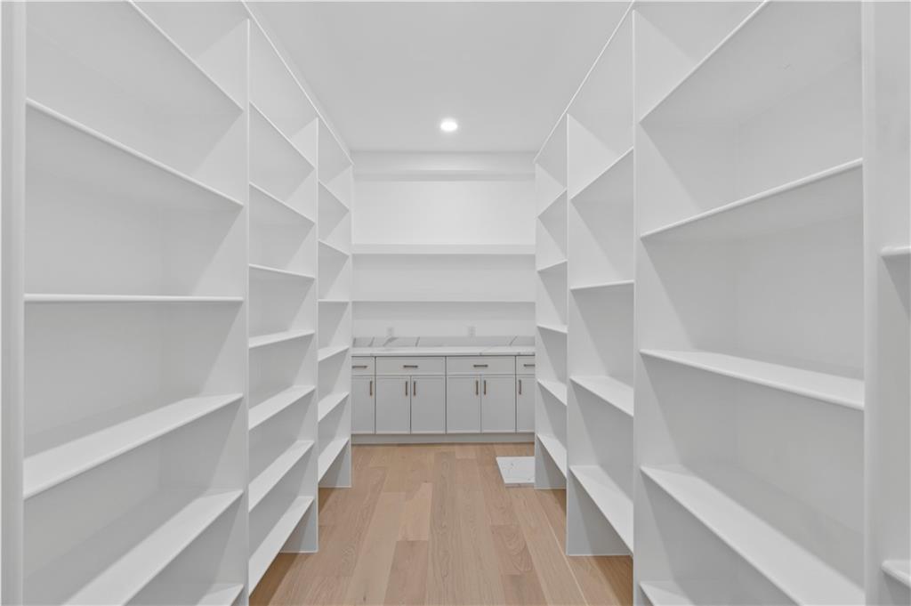 2709 Collins Hill Road Lawrenceville, GA 30043 - Photo 22 of 67 a view of walk in closet with empty racks