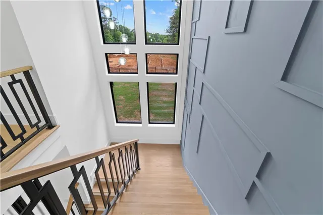 a view of entryway with stairs and wooden floor