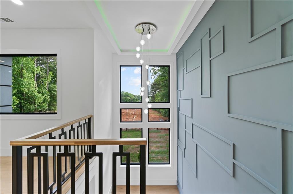 2709 Collins Hill Road Lawrenceville, GA 30043 - Photo 25 of 67 a view of entryway with stairs and wooden floor