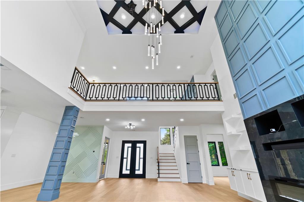 2709 Collins Hill Road Lawrenceville, GA 30043 - Photo 8 of 67 a view of entryway livingroom and hall with wooden floor