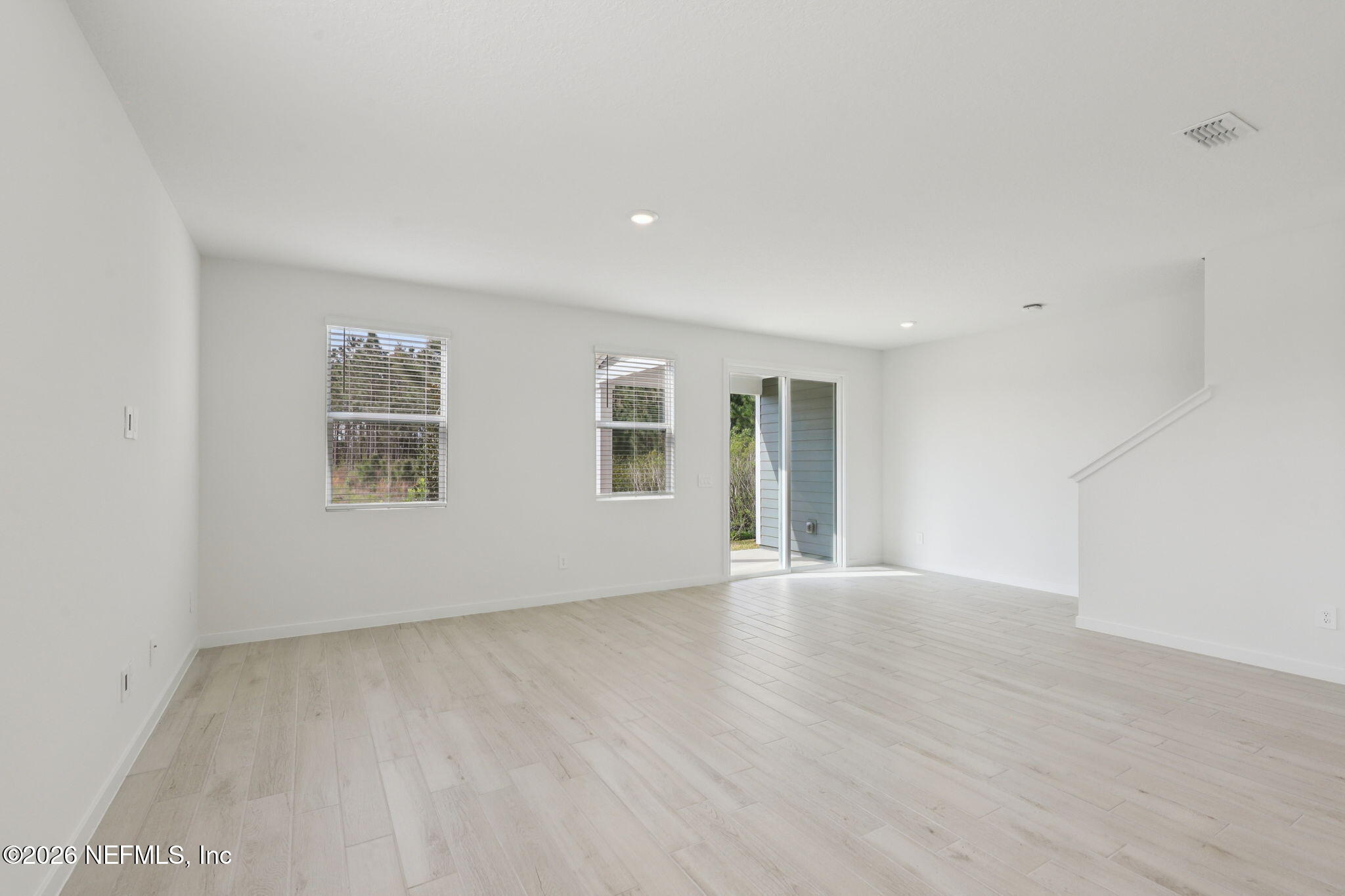 25 Rangeline Drive St. Augustine, FL 32092 - Photo 25 of 43 a view of an empty room with wooden floor and a window