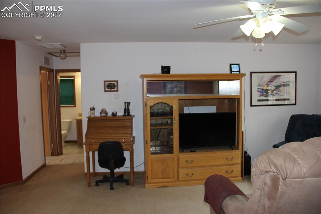 749 9th Street Calhan, CO 80808 - Photo 14 of 43 a living room with furniture and a fireplace