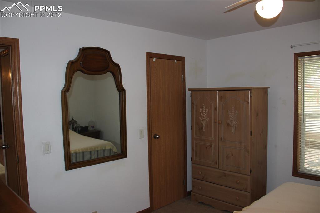 749 9th Street Calhan, CO 80808 - Photo 19 of 43 a view of a hallway with wooden floor and entryway