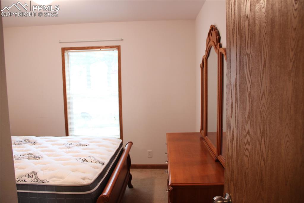 749 9th Street Calhan, CO 80808 - Photo 21 of 43 wooden floor with a view of a living room