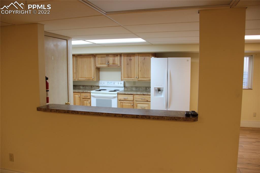 749 9th Street Calhan, CO 80808 - Photo 31 of 43 a view of a kitchen with wooden floor and windows