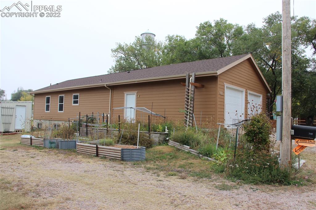 749 9th Street Calhan, CO 80808 - Photo 42 of 43 a view of a house with a yard