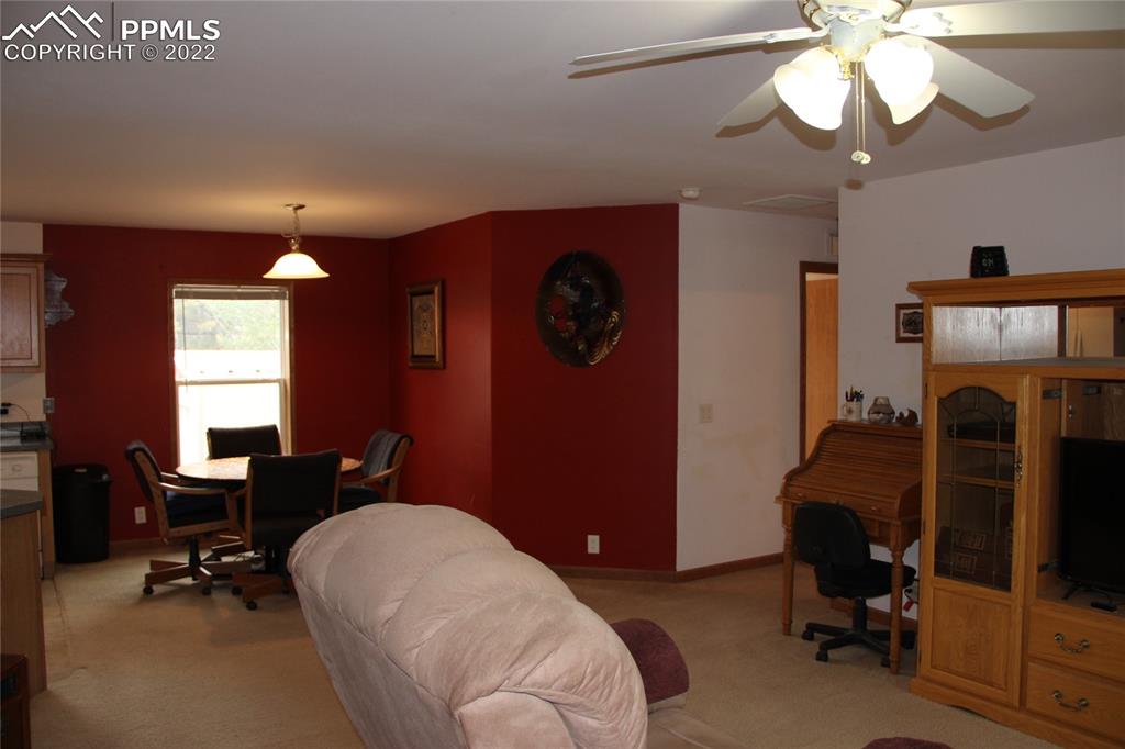 749 9th Street Calhan, CO 80808 - Photo 9 of 43 a bedroom with a bed and a chandelier