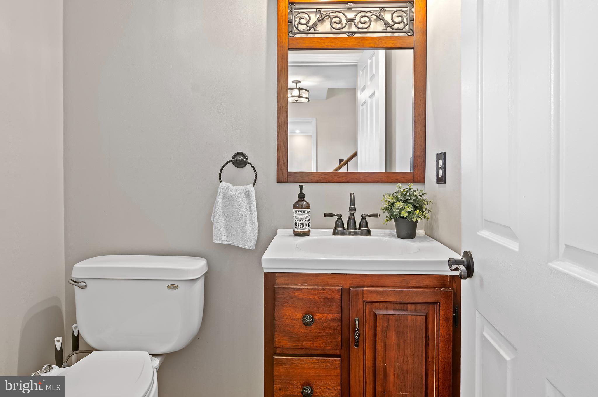 40 Dorba Court Severna Park, MD 21146 - Photo 23 of 67 a bathroom with a toilet sink and mirror