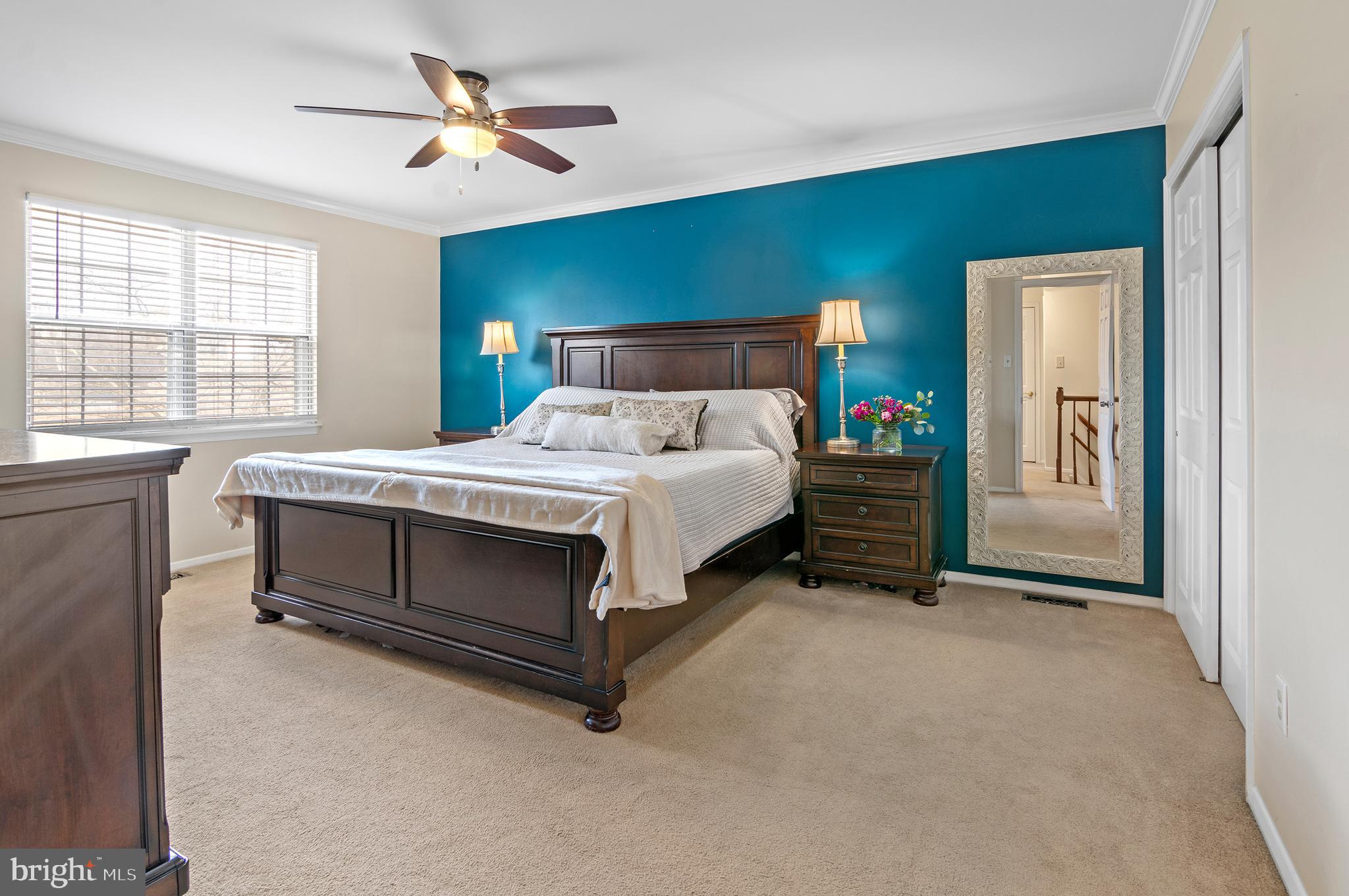 40 Dorba Court Severna Park, MD 21146 - Photo 25 of 67 a bedroom with a bed and a chandelier