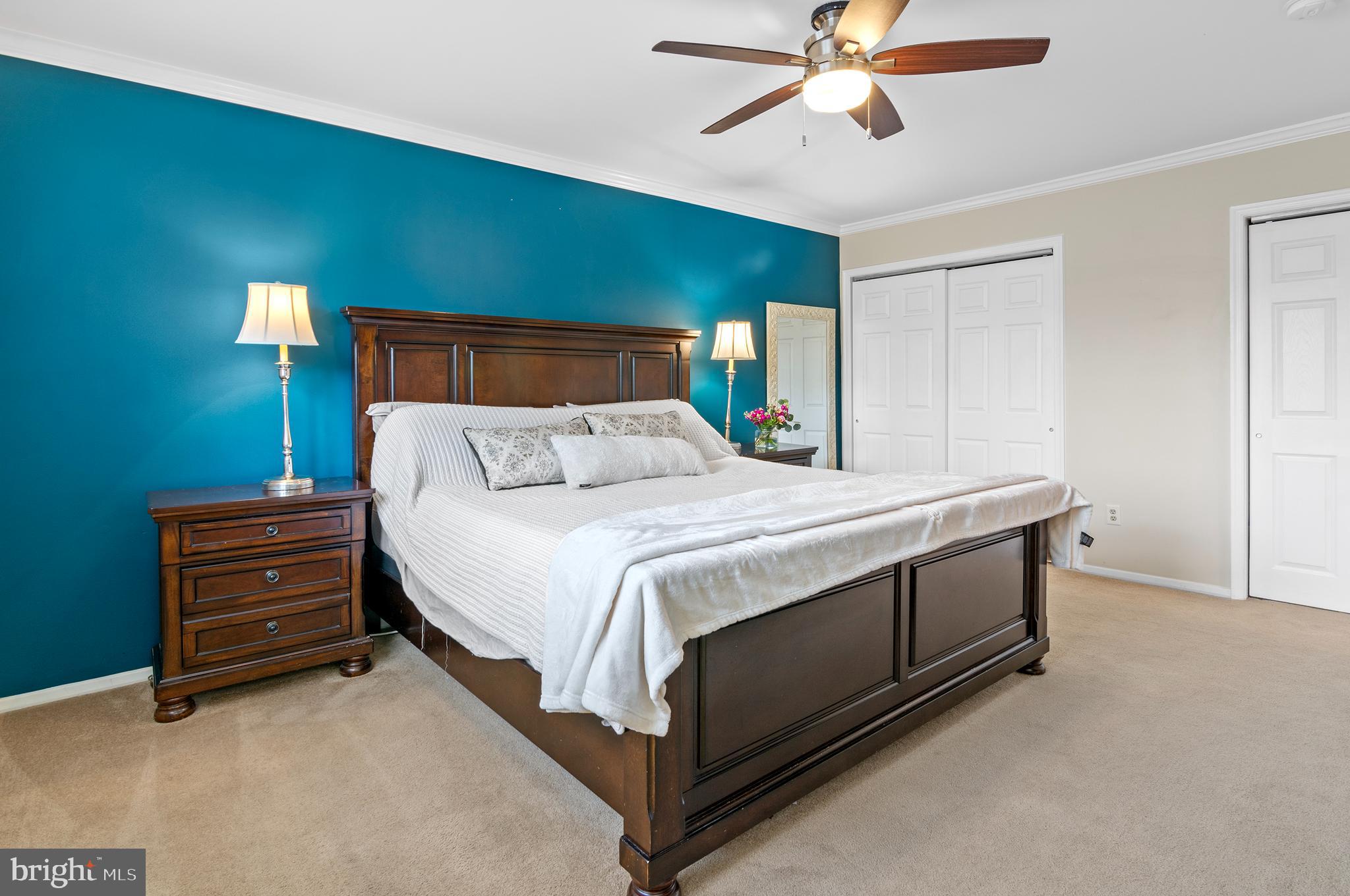 40 Dorba Court Severna Park, MD 21146 - Photo 27 of 67 a bedroom with a bed and a chandelier