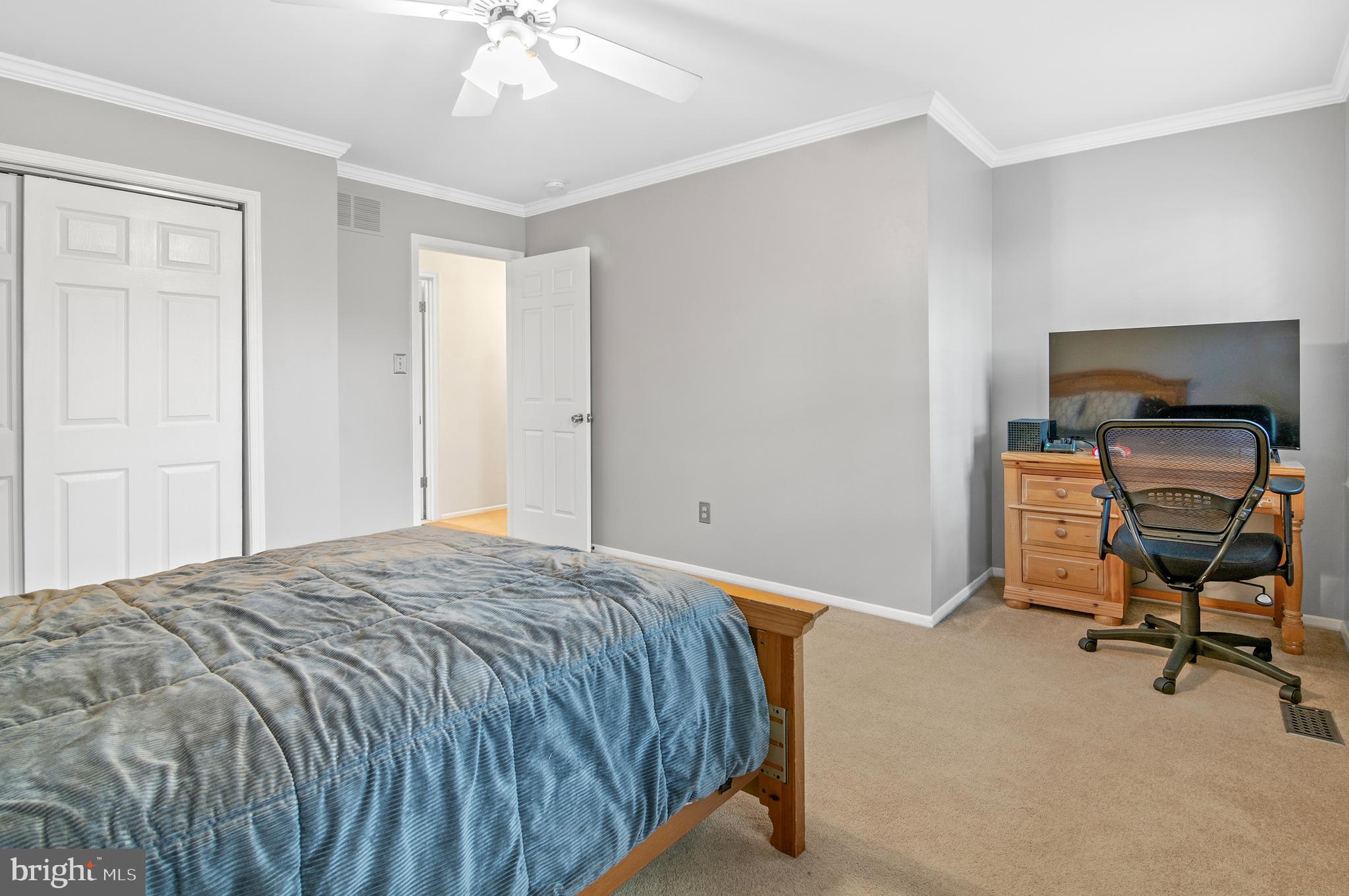 40 Dorba Court Severna Park, MD 21146 - Photo 31 of 67 a bedroom with a bed and a chair in it