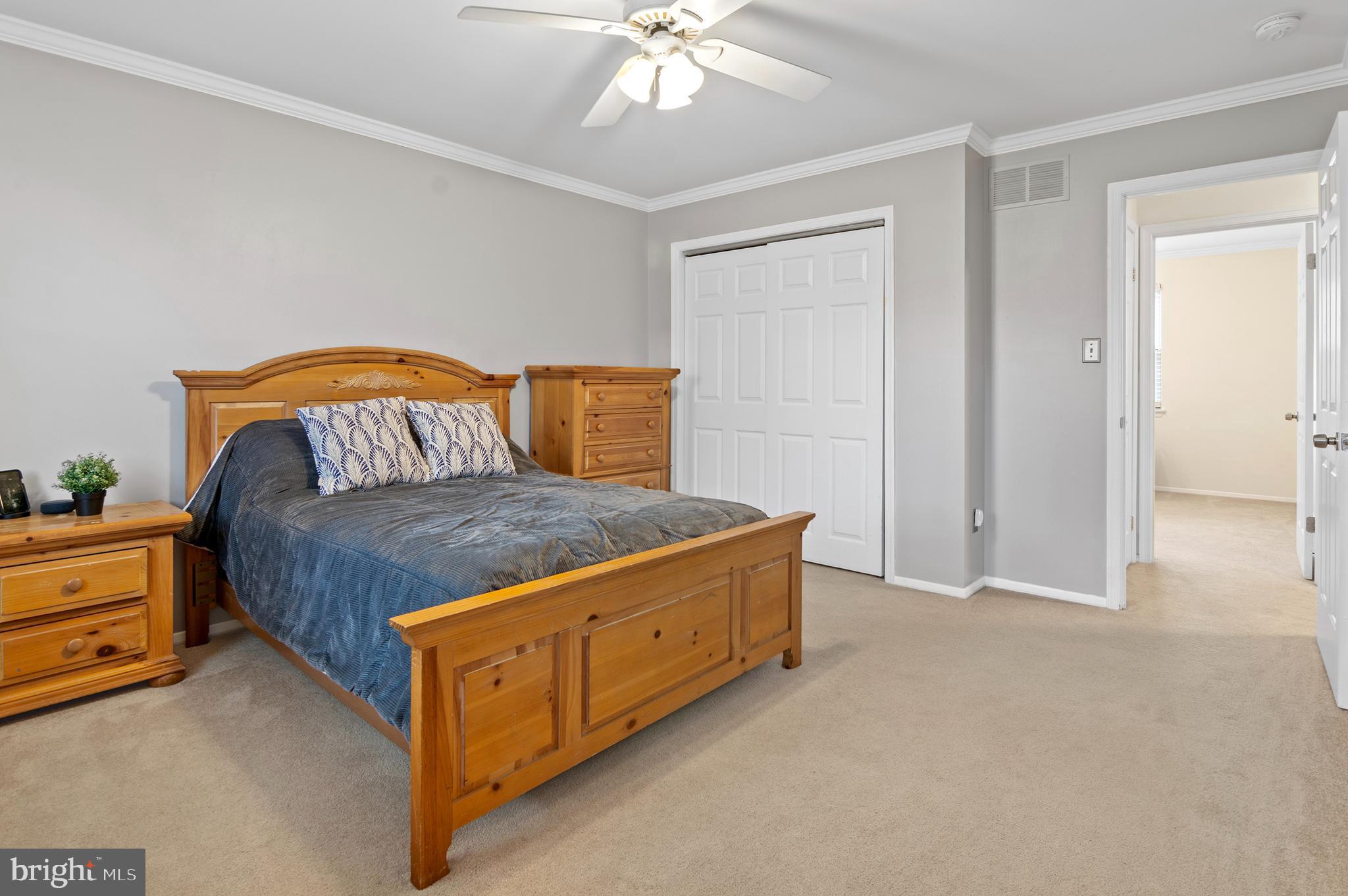 40 Dorba Court Severna Park, MD 21146 - Photo 32 of 67 a bedroom with a bed and a chandelier