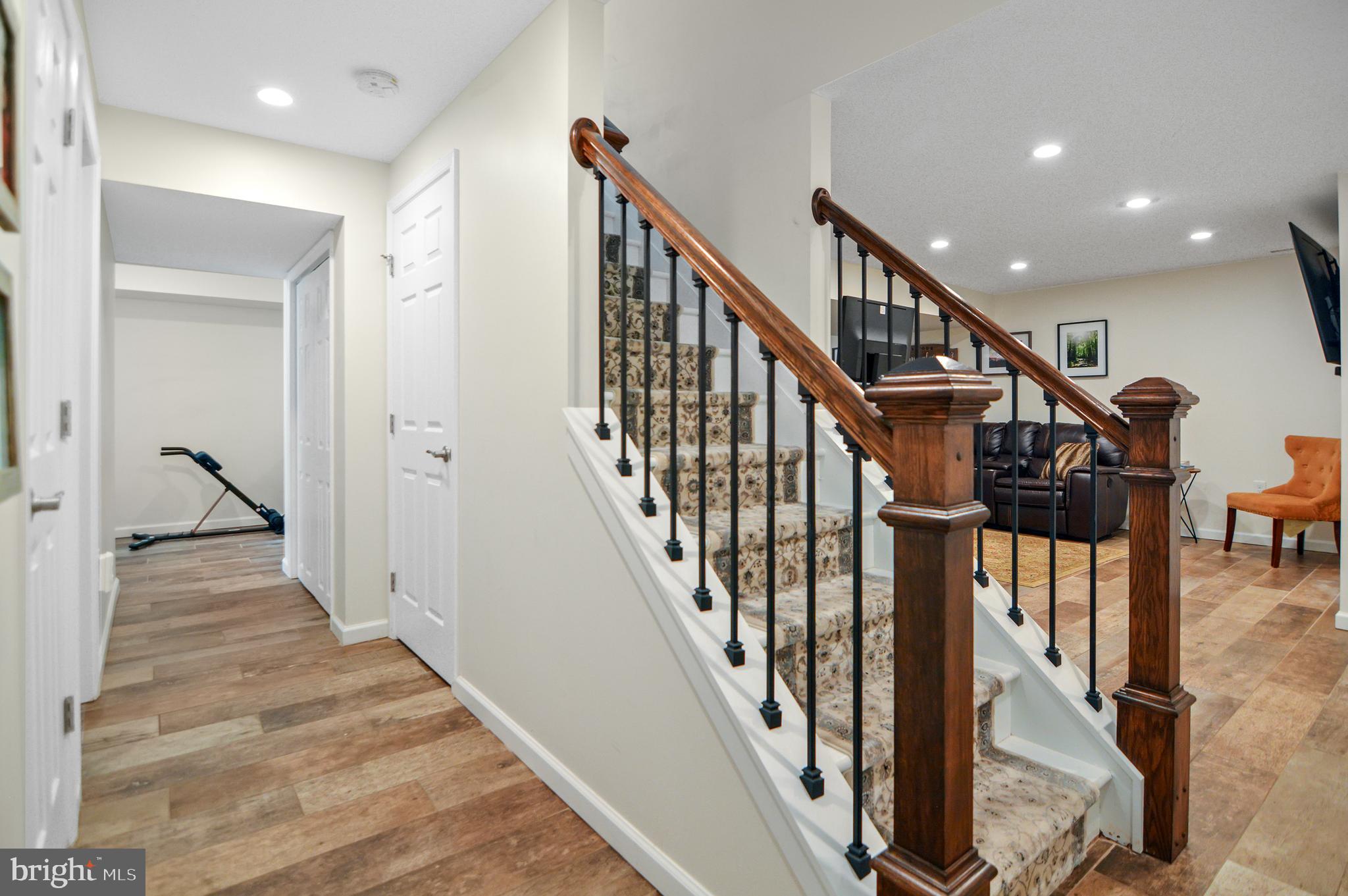 40 Dorba Court Severna Park, MD 21146 - Photo 41 of 67 a view of staircase with lots of frames on wall and wooden floor