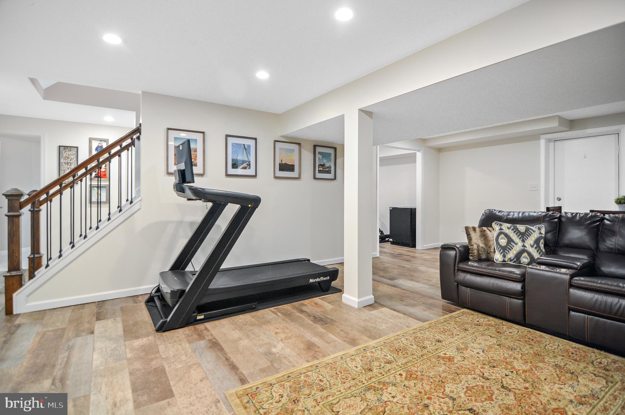 40 Dorba Court Severna Park, MD 21146 - Photo 44 of 67 a living room with furniture and a wooden floor