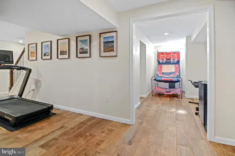 a wooden bench sitting in the middle of a yard