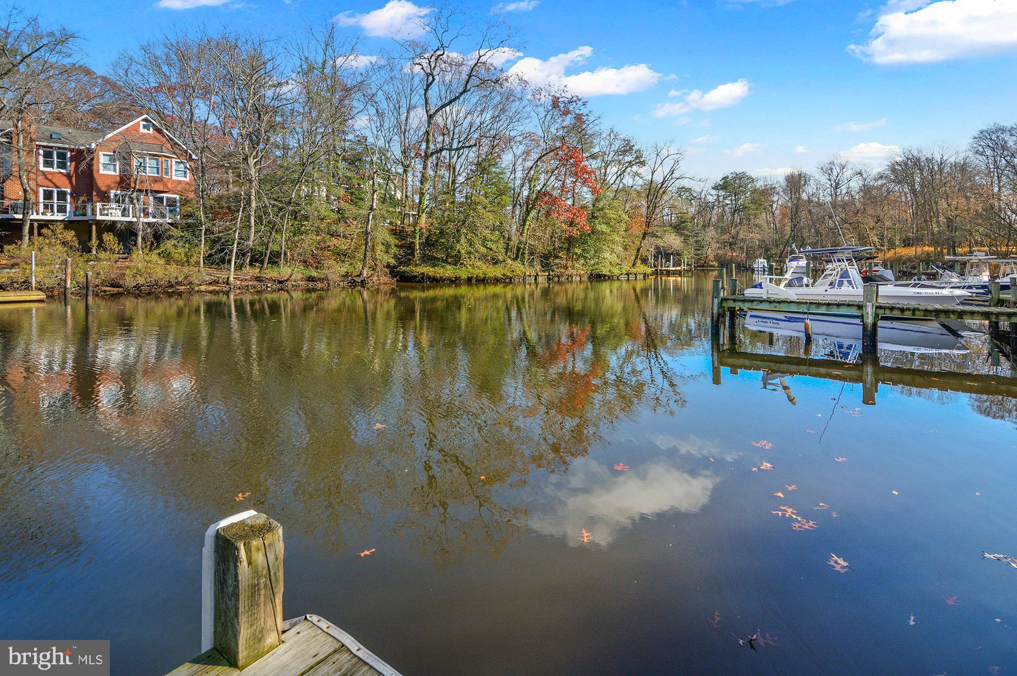 40 Dorba Court Severna Park, MD 21146 - Photo 63 of 67 a view of a lake with a house in the background