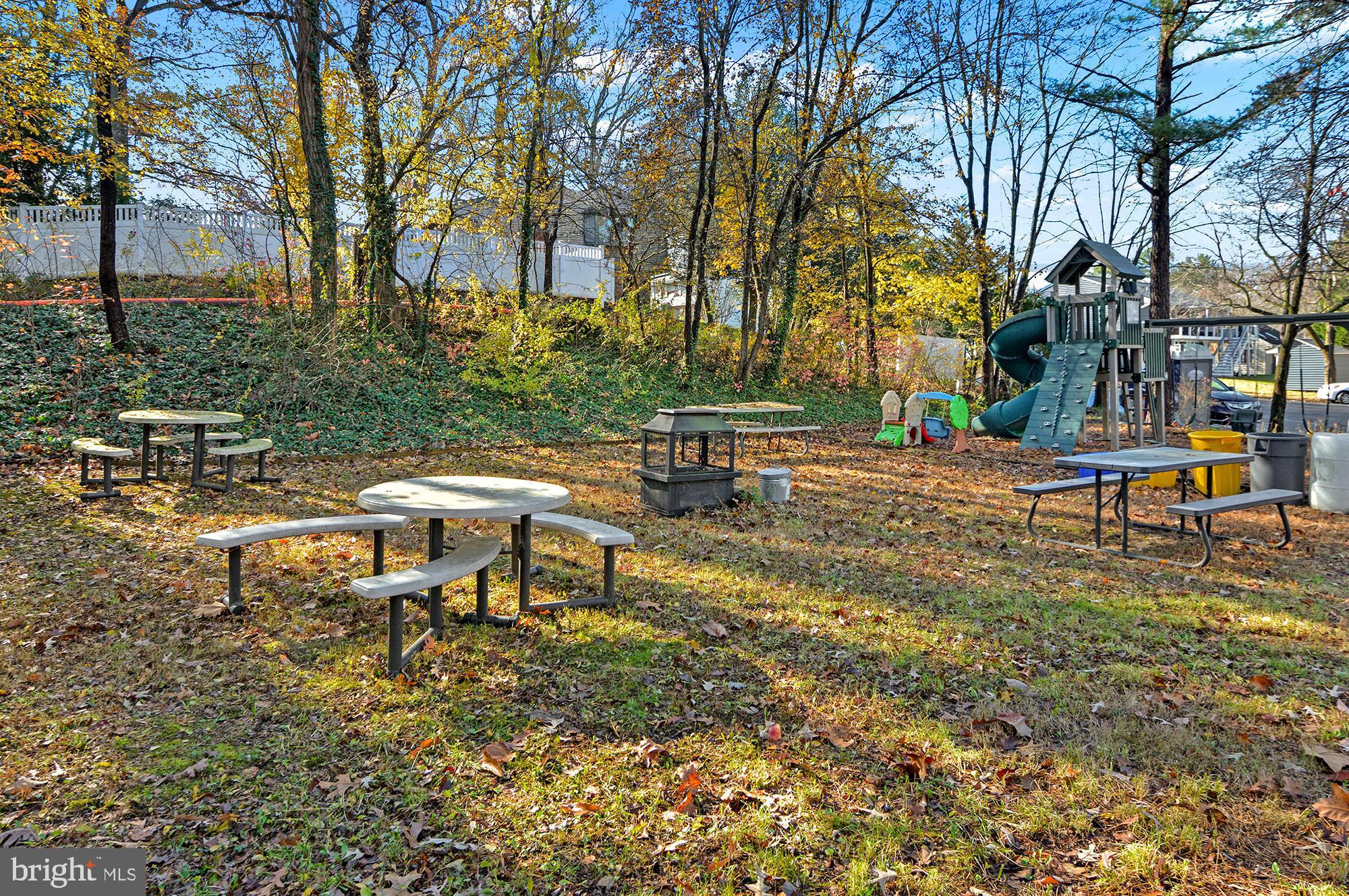 40 Dorba Court Severna Park, MD 21146 - Photo 66 of 67 a backyard of a house with table and chairs