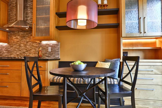 a view of a dining room with furniture and chandelier