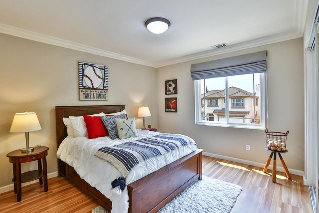 a bedroom with a bed and a table