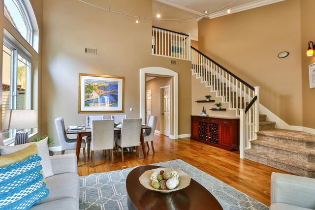 a living room with fireplace furniture and a wooden floor