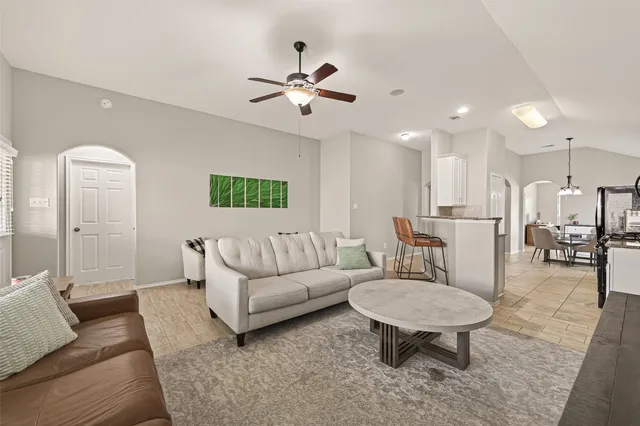 a living room with furniture and a table