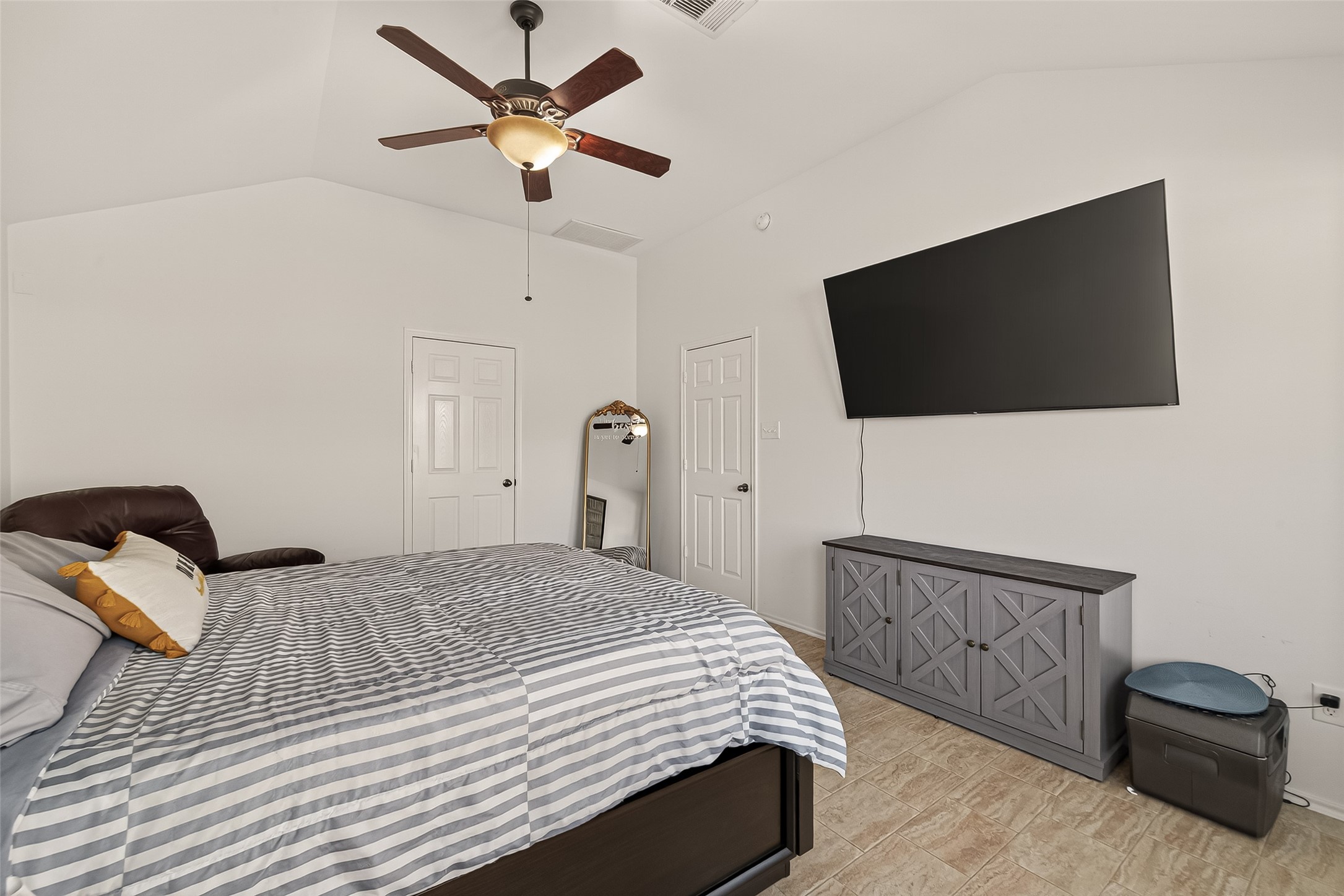 15607 Mossy Park Cypress, TX 77429 - Photo 22 of 34 a bedroom with a bed and a flat screen tv