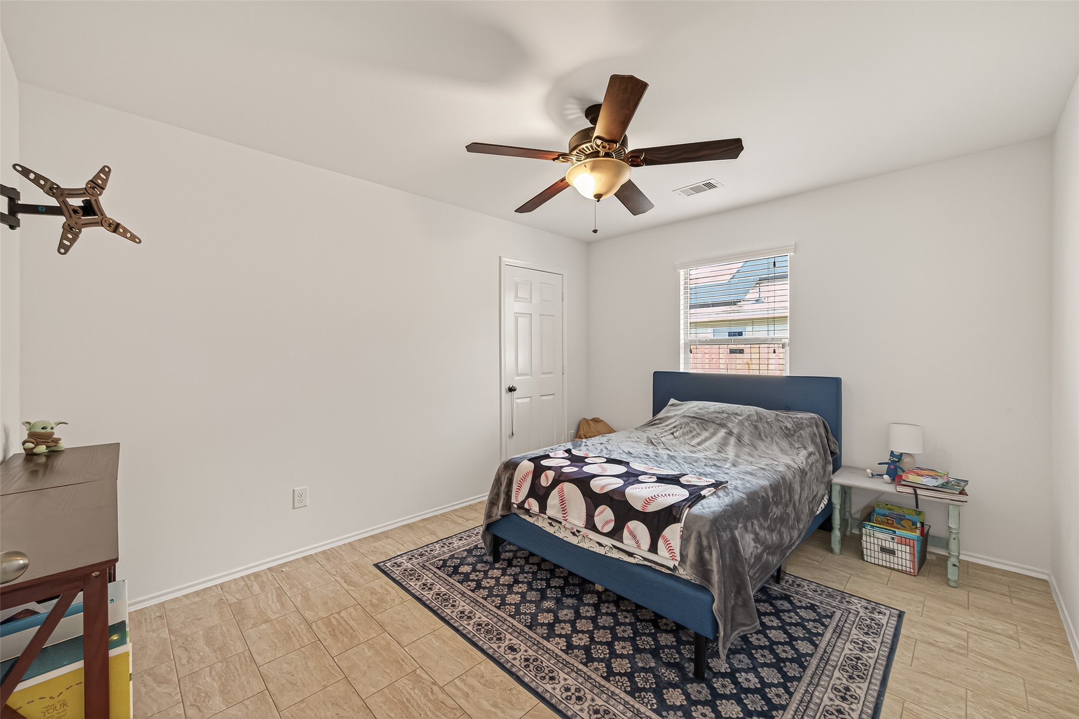 15607 Mossy Park Cypress, TX 77429 - Photo 27 of 34 a bedroom with a bed and wooden floor