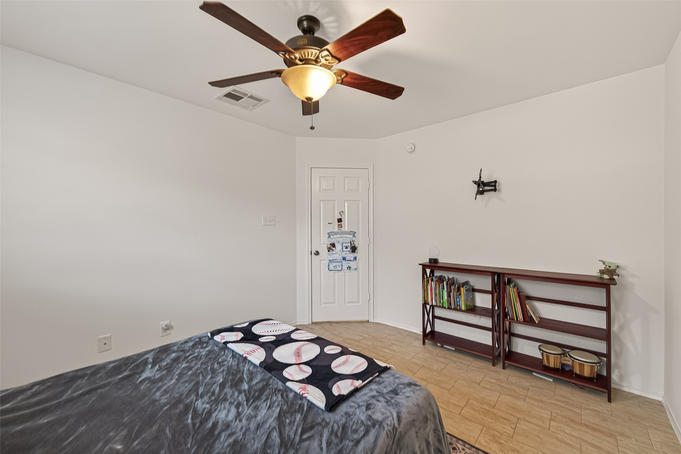 15607 Mossy Park Cypress, TX 77429 - Photo 28 of 34 a bedroom with a bed and a ceiling fan