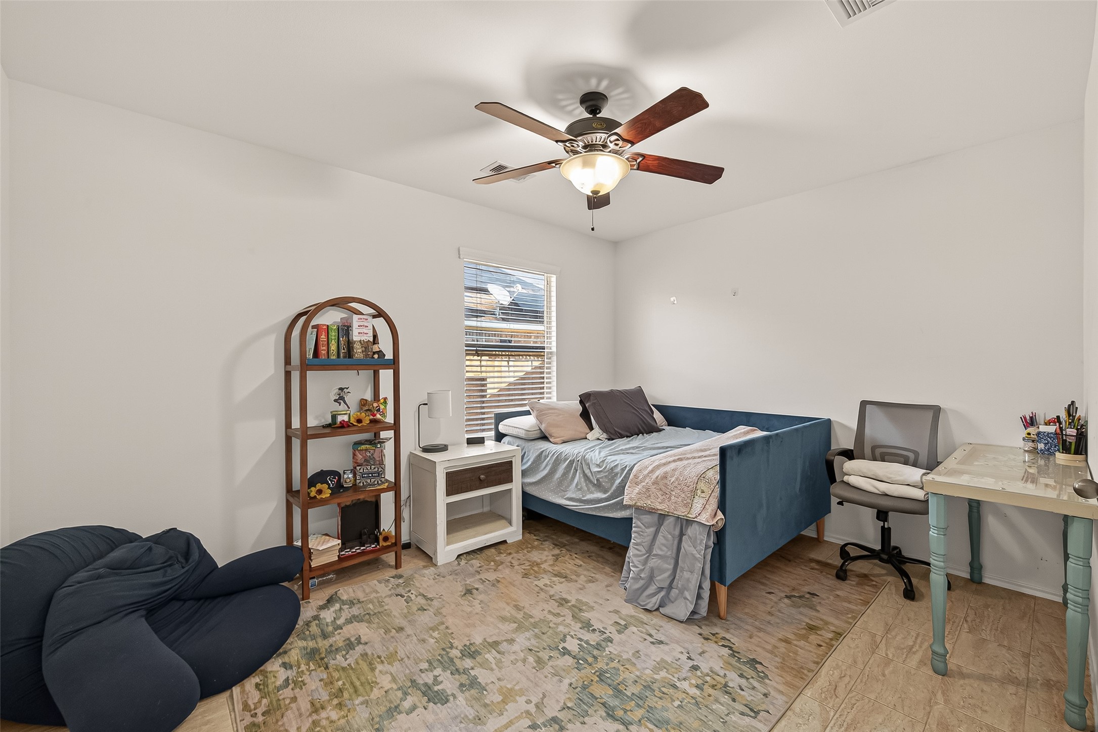 15607 Mossy Park Cypress, TX 77429 - Photo 29 of 34 a bedroom with furniture and a window