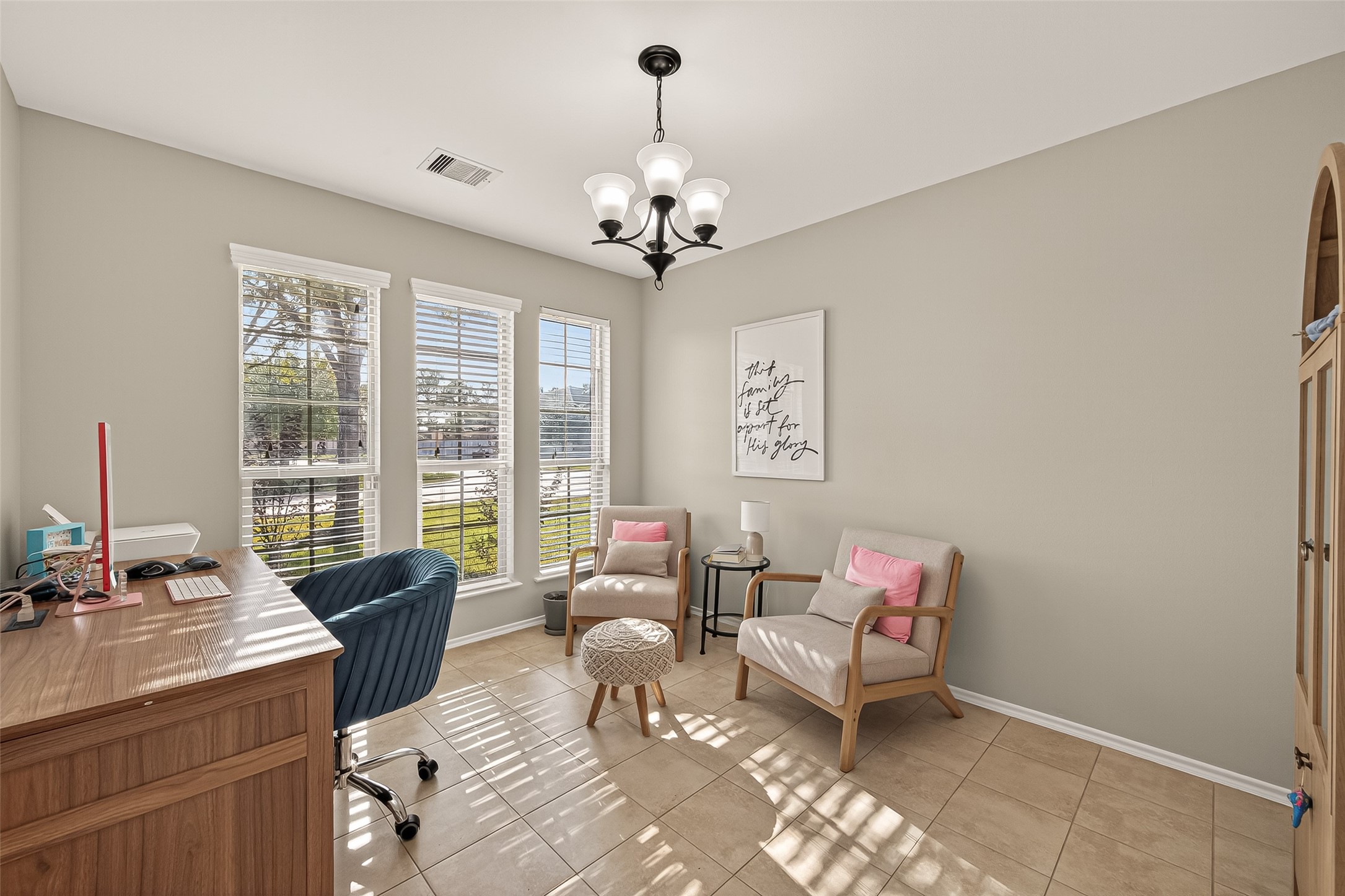 15607 Mossy Park Cypress, TX 77429 - Photo 6 of 34 a living room with furniture two window and a chandelier