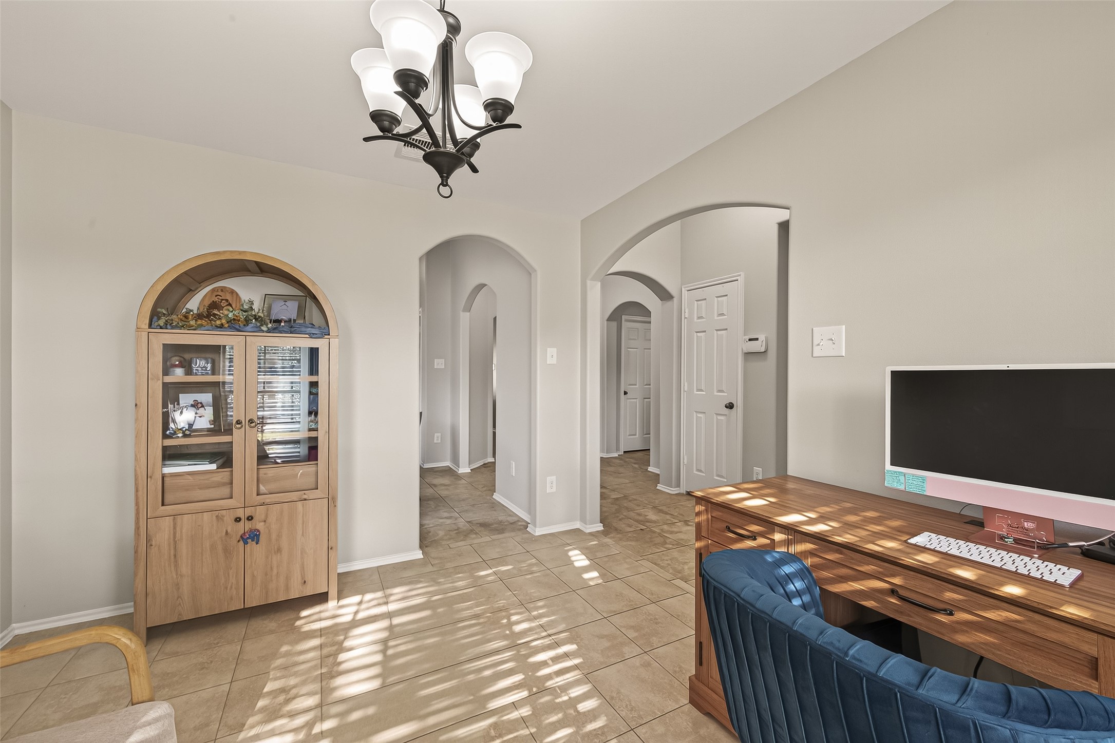 15607 Mossy Park Cypress, TX 77429 - Photo 7 of 34 a living room with furniture and a flat screen tv