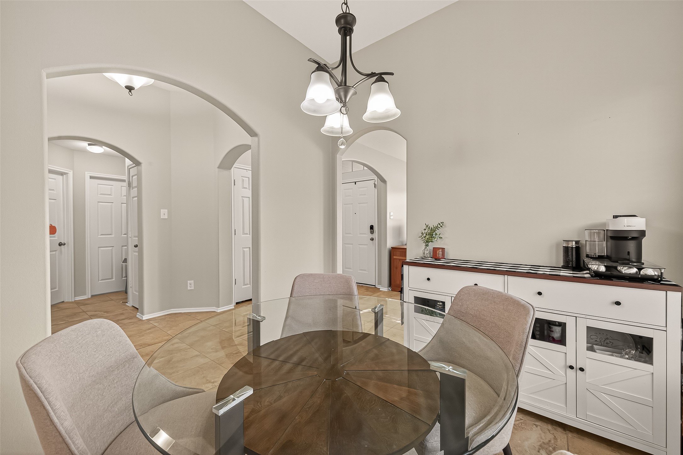 15607 Mossy Park Cypress, TX 77429 - Photo 10 of 34 a living room with furniture a chandelier and a fireplace