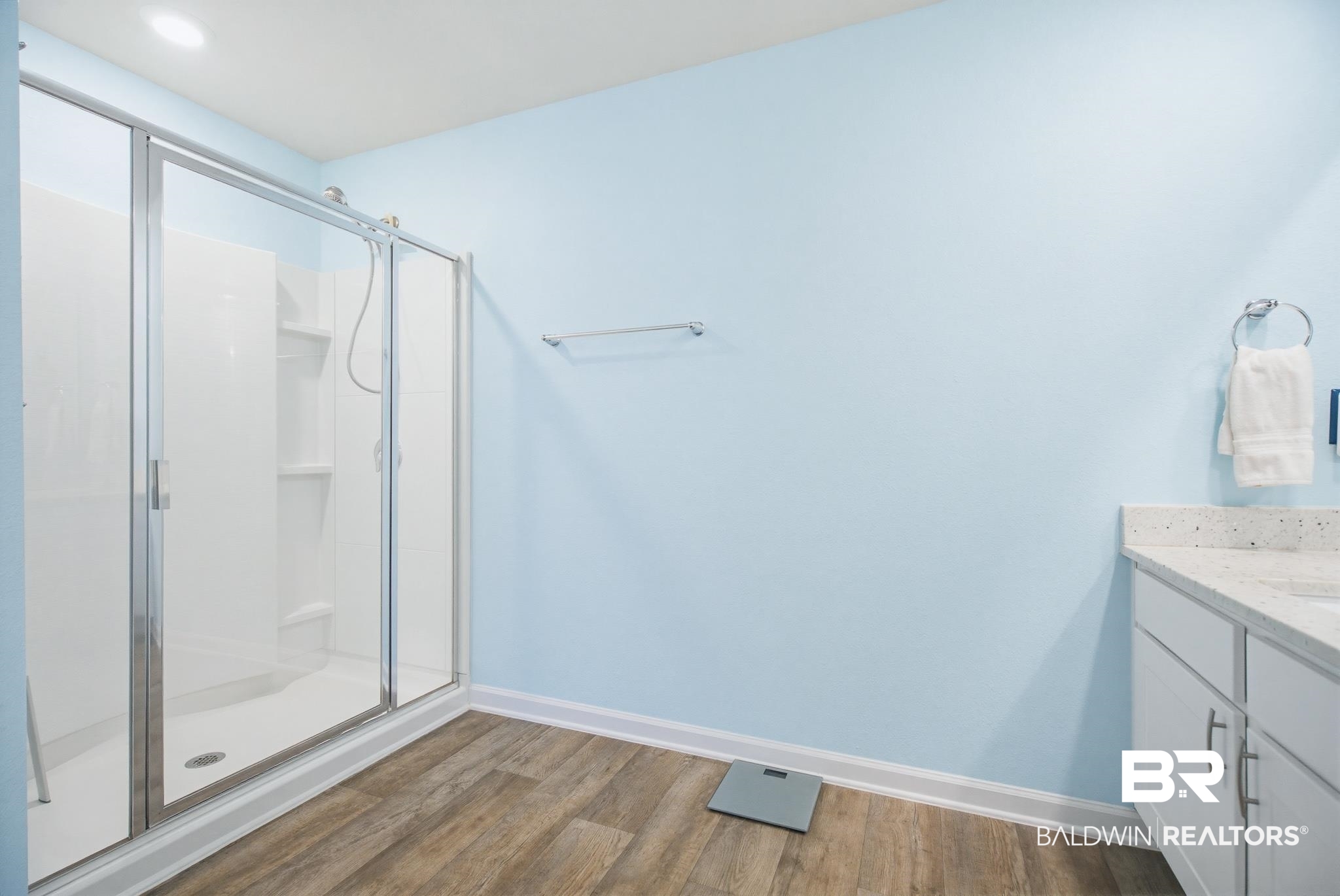 261 Fulham Lane Foley, AL 36535 - Photo 37 of 50 Full bath with a shower stall, vanity, and dark wood-type flooring