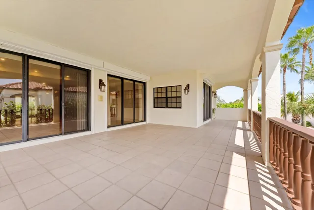 a view of an empty room with glass door