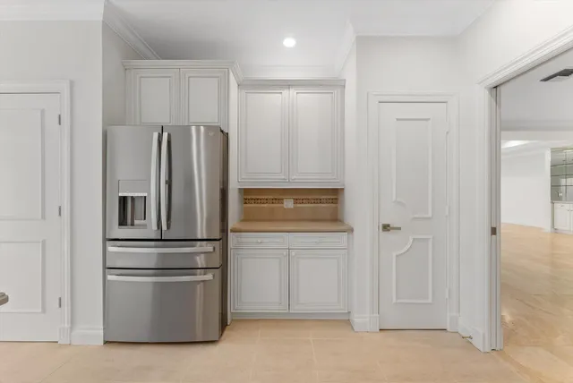 a kitchen with cabinets stainless steel appliances and sink