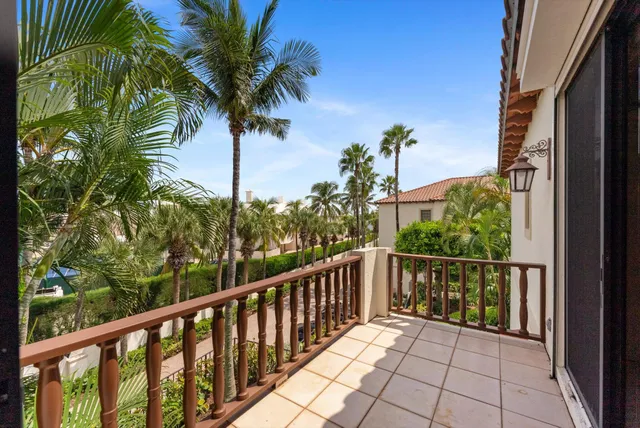 a view of a kitchen with refrigerator and a sink