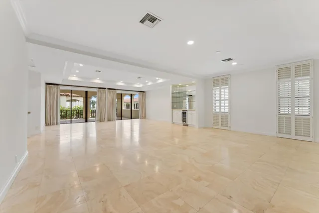 a view of an entryway with a floor to ceiling window
