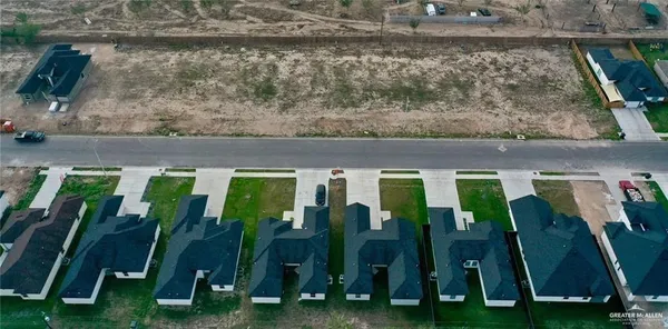 a view of swimming pool with lawn chairs