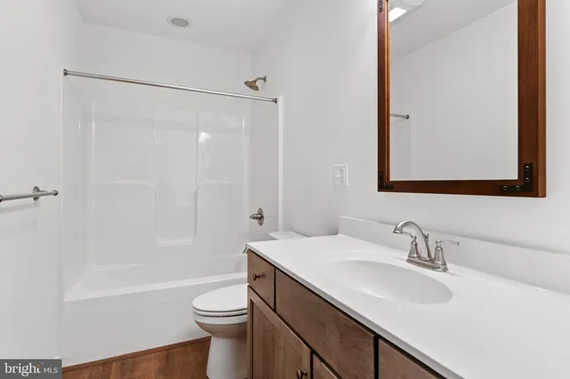 a bathroom with a sink a toilet and a bathtub