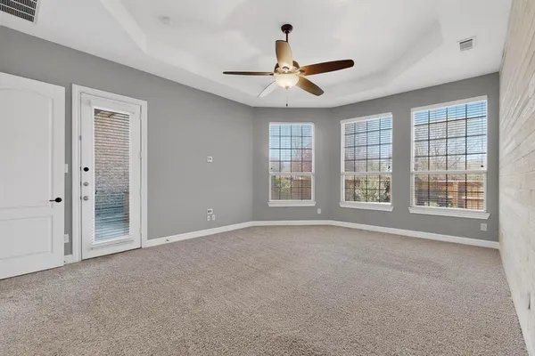 a view of an empty room with a window