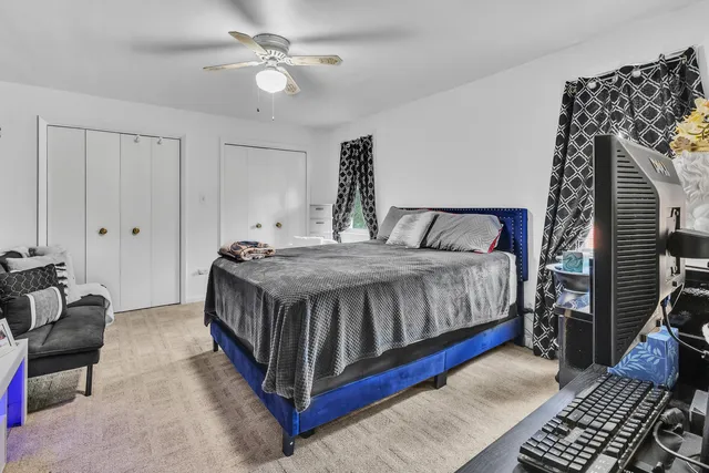 a bedroom with a bed and window