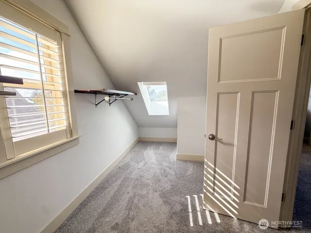 a view of a hallway with windows